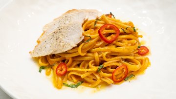 Chicken Linguine with Creamy Gochujang Peanut Sauce, Chili Crunch & Basil